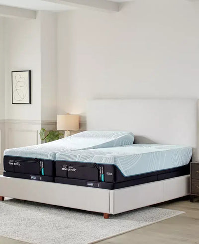 Tempur-Pedic TEMPUR-ProAdapt® Medium Hybrid 12" Mattress set up on a modern bed frame in a stylish bedroom setting.