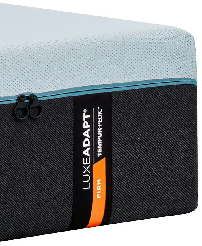 Tempur-Pedic TEMPUR-LuxeAdapt® 13" Firm Mattress close-up showing top surface and label.