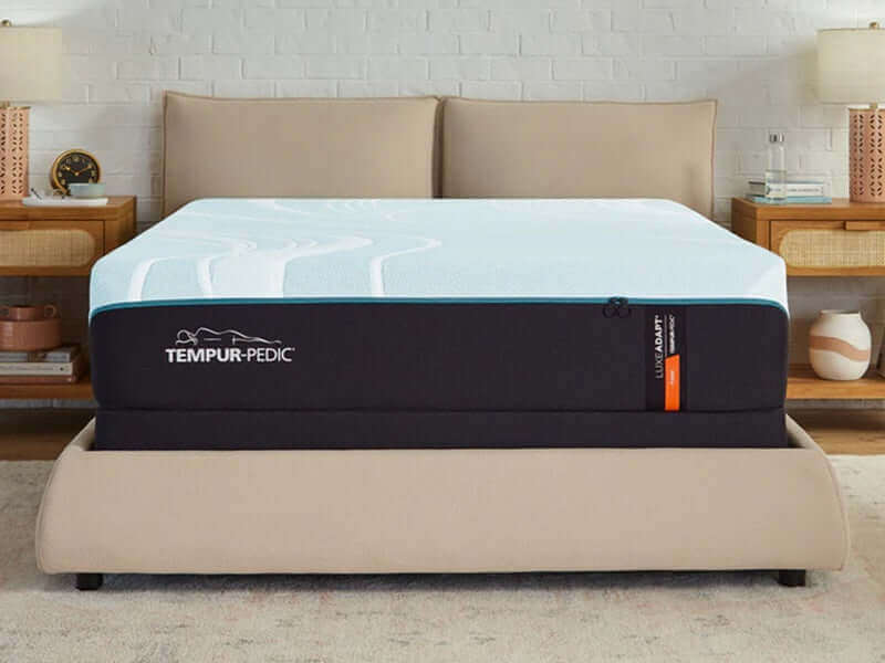 Tempur-Pedic TEMPUR-LuxeAdapt® 13" Firm Mattress on a stylish bed frame, showcasing its luxurious design and comfort features.