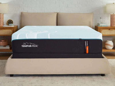 Tempur-Pedic TEMPUR-LuxeAdapt® 13" Firm Mattress on a stylish bed frame, showcasing its luxurious design and comfort features.