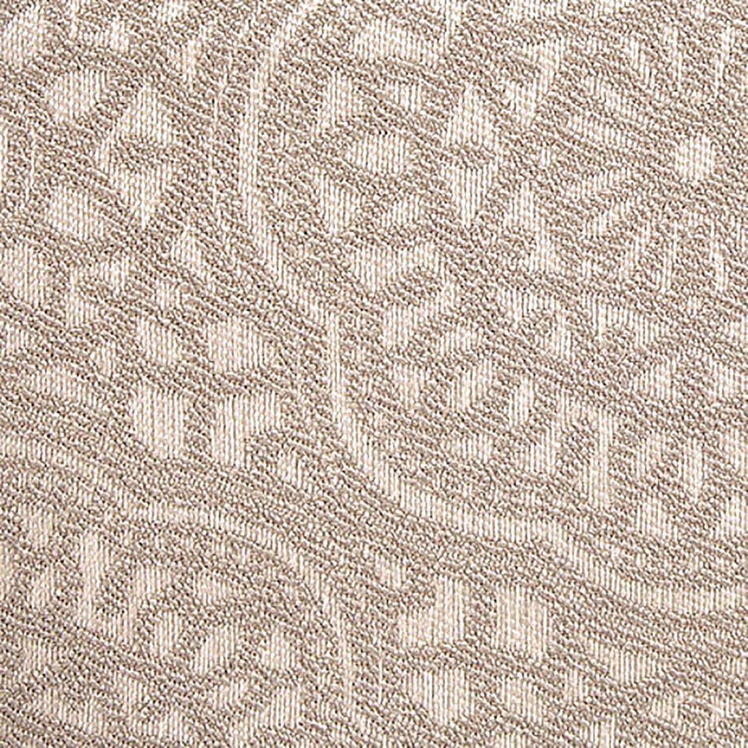 Close-up of intricate light beige patterned fabric with elegant design details.