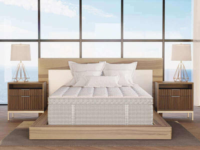 Modern bedroom featuring a CA King Diamond Lucille Firm Natural Latex mattress with hand-tufted design and elegant decor.