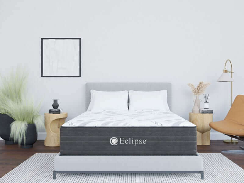 Eclipse Cares Collection Ease Hybrid 10" Firm Mattress in modern bedroom setting with stylish décor.