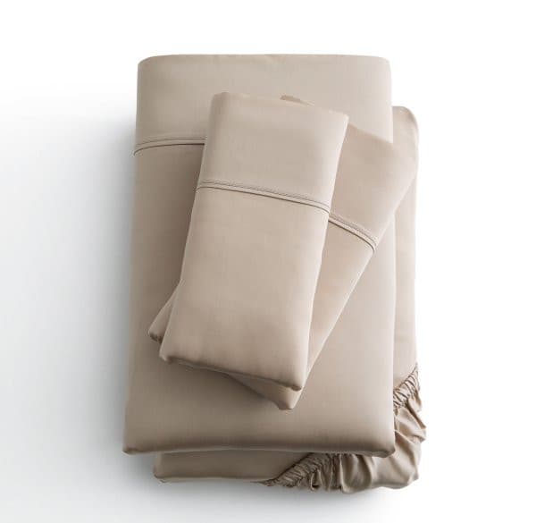 Malouf Botanical Tencel™ Lyocell Sheet Set in a beige color, showcasing the flat sheet, fitted sheet, and pillowcases.