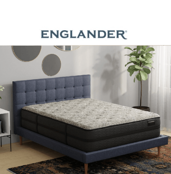 Stylish Englander mattress on a modern bed frame in a contemporary bedroom setting with decorative mirrors.