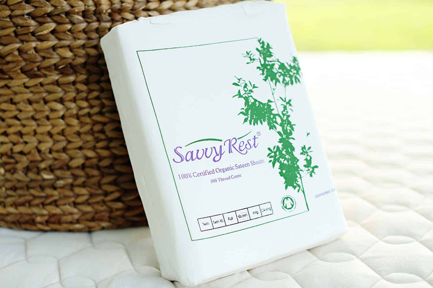 Savvy Rest 100% certified organic cotton sheet set packaging on a soft surface, showcasing eco-friendly bedding quality.