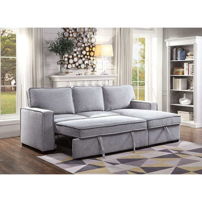 Ines Gray Sectional Sofa with chaise, showcasing modern design and storage, convertible to a sleeper bed.