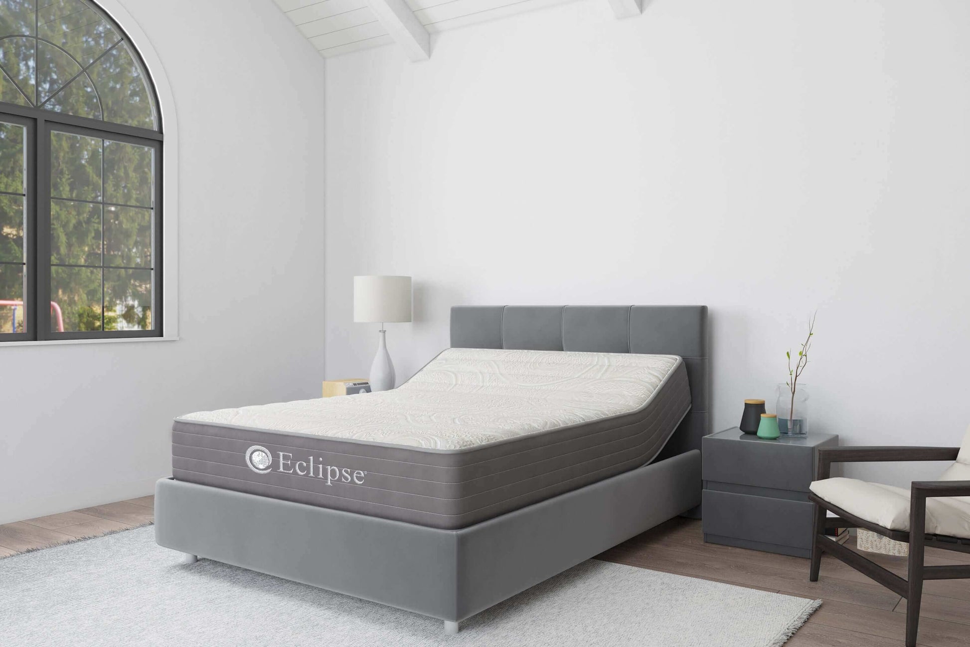 Eclipse Cares Collection Kindness Hybrid 13" Firm Mattress in modern bedroom setting with stylish furniture and natural light.