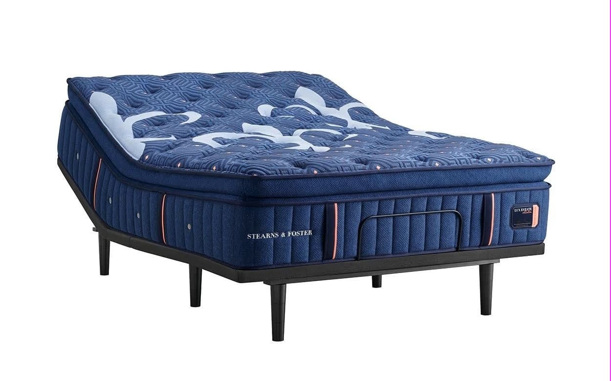 Stearns & Foster Lux Estate® Firm Pillow Top 16" Mattress on a stylish platform bed, showcasing luxury craftsmanship and design.