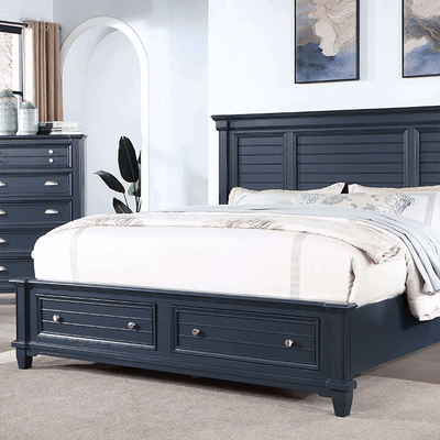 Manzanillo Slate Blue storage bed featuring a tall panel headboard and two spacious footboard drawers for extra linen storage.