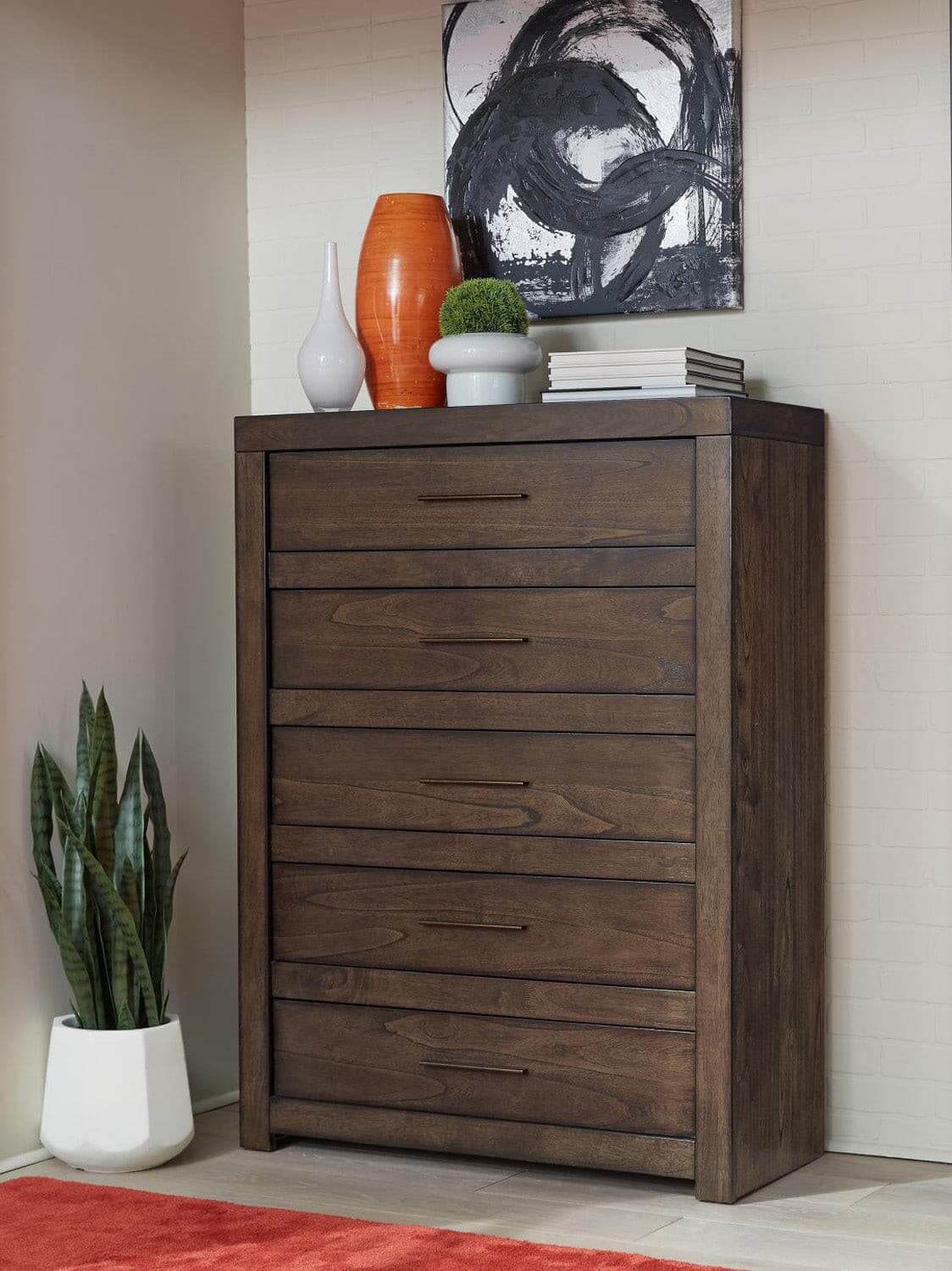 Modern Loft Collection brownstone chest with aged bronze pulls in stylish living space. Classic design blends with decor.