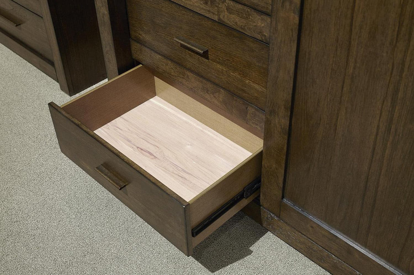 Open drawer of the Modern Loft Collection Brownstone Sliding Door Chest showcasing its solid construction and elegant interior design.