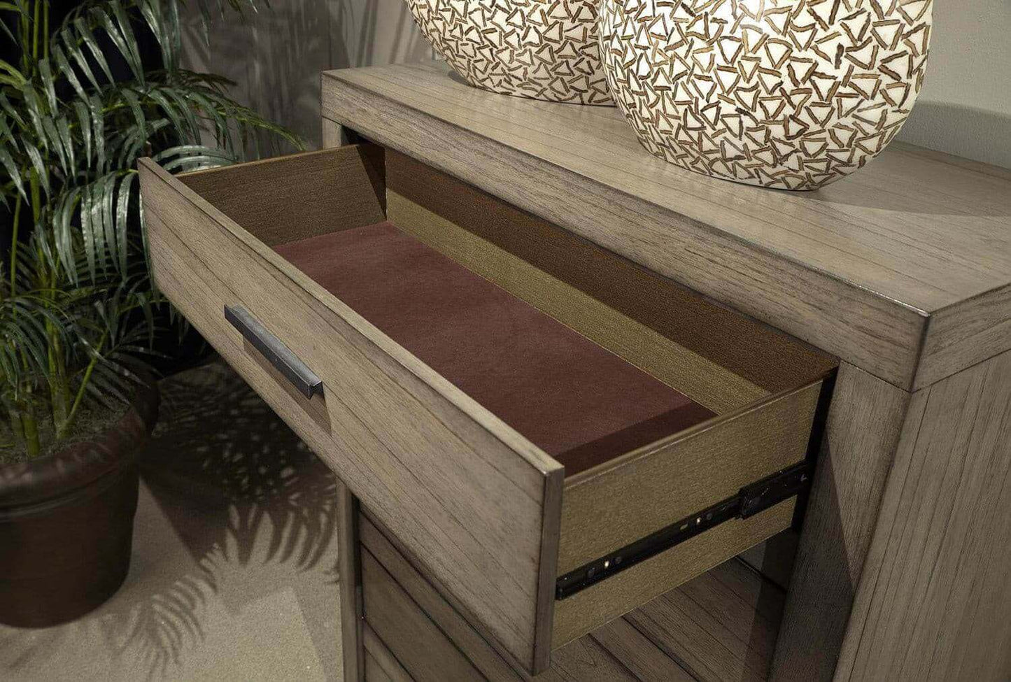 Open drawer of Modern Loft Collection Graystone Chest showcasing quality craftsmanship and rich interior lining.