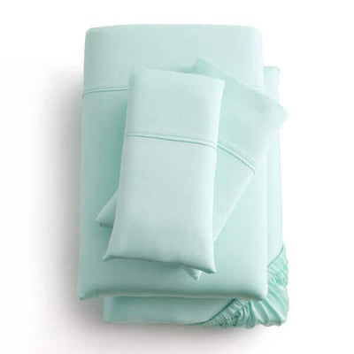 Mint green Malouf Opal Botanical Tencel™ Lyocell sheet set featuring a fitted sheet, flat sheet, and pillowcases.