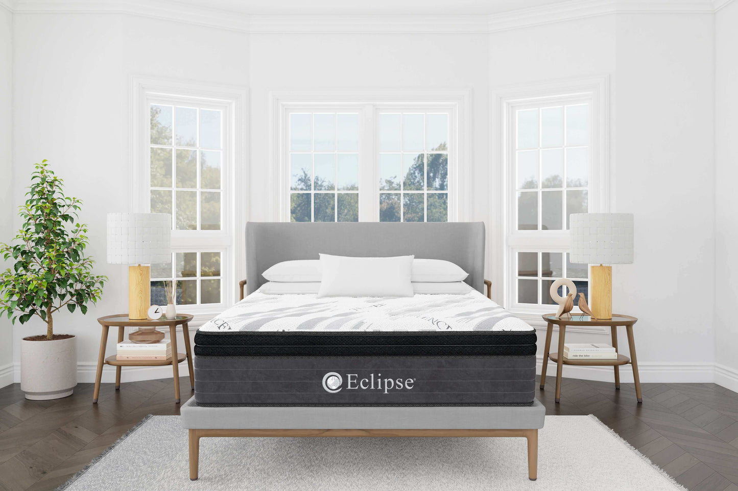 Eclipse Cares Collection Peacefulness Hybrid 12" Medium Mattress in a bright, stylish bedroom setting with natural light.