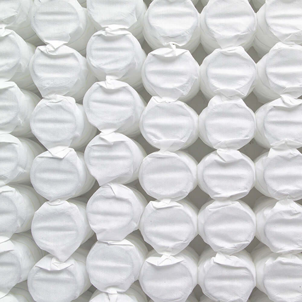 A close-up view of neatly stacked white cotton rounds, ideal for skincare and cosmetic use.
