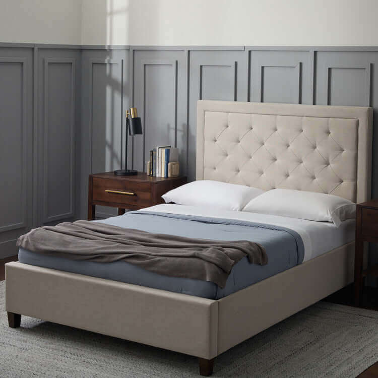 Elegant Malouf Hennessy Stone Grey Headboard with tufted design in a modern bedroom setting.