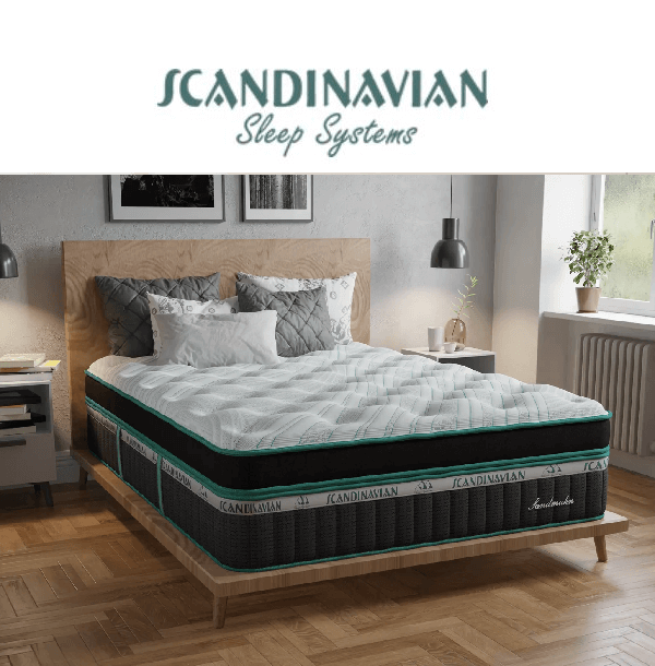 Elegant Scandinavian Sleep Systems mattress on a stylish wooden bed in a cozy bedroom setting.