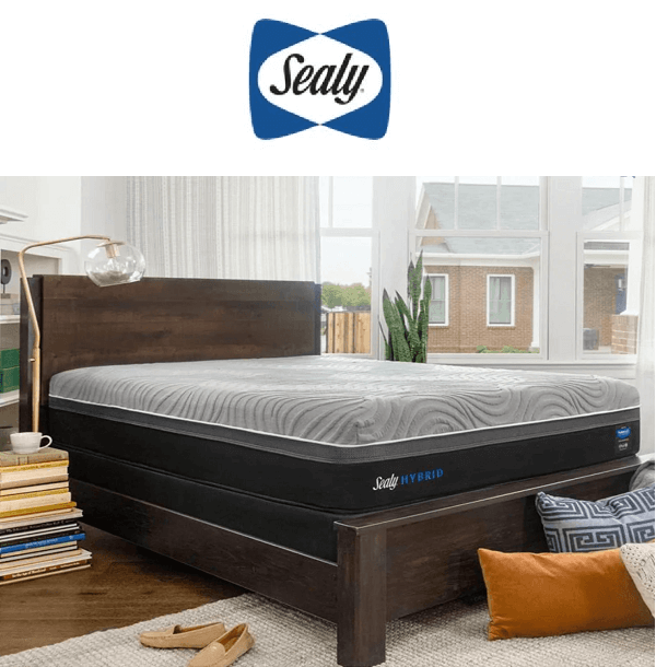 Sealy Hybrid mattress on a wooden bed frame in a bright bedroom, showcasing comfort and modern design.