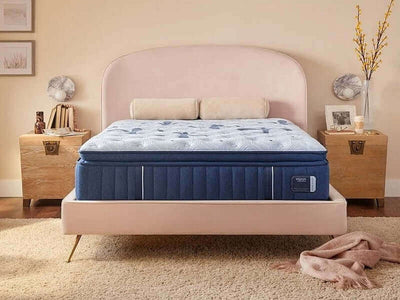 Stearns & Foster Estate 15" Firm Euro Pillow Top Mattress on a stylish bed with a pink headboard and wooden nightstands.