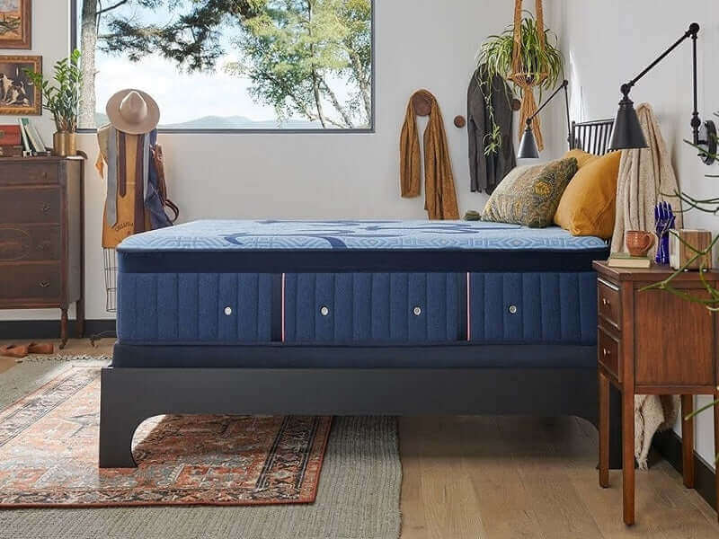 Stearns & Foster Lux Hybrid Plush 14.5" mattress in a stylish bedroom with modern decor and natural light.