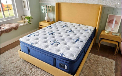 Stearns & Foster Studio Medium Euro Pillow Top mattress on a stylish bed, showcasing comfort and elegant design in a cozy bedroom setting.