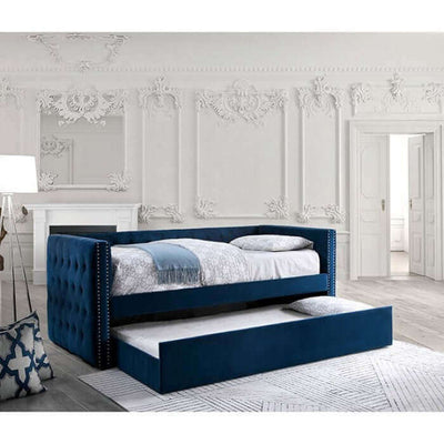 Susanna Navy Blue Daybed with button tufting and pull-out trundle in an elegant room setting.