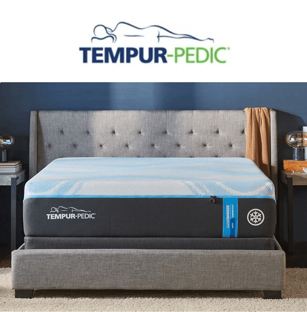 Tempur-Pedic memory foam mattress on a stylish bed frame in a modern bedroom setting.