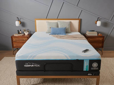 Tempur-Pedic TEMPUR-ProBreeze® Medium Hybrid 12" mattress displayed on a stylish bed setup, featuring modern decor.