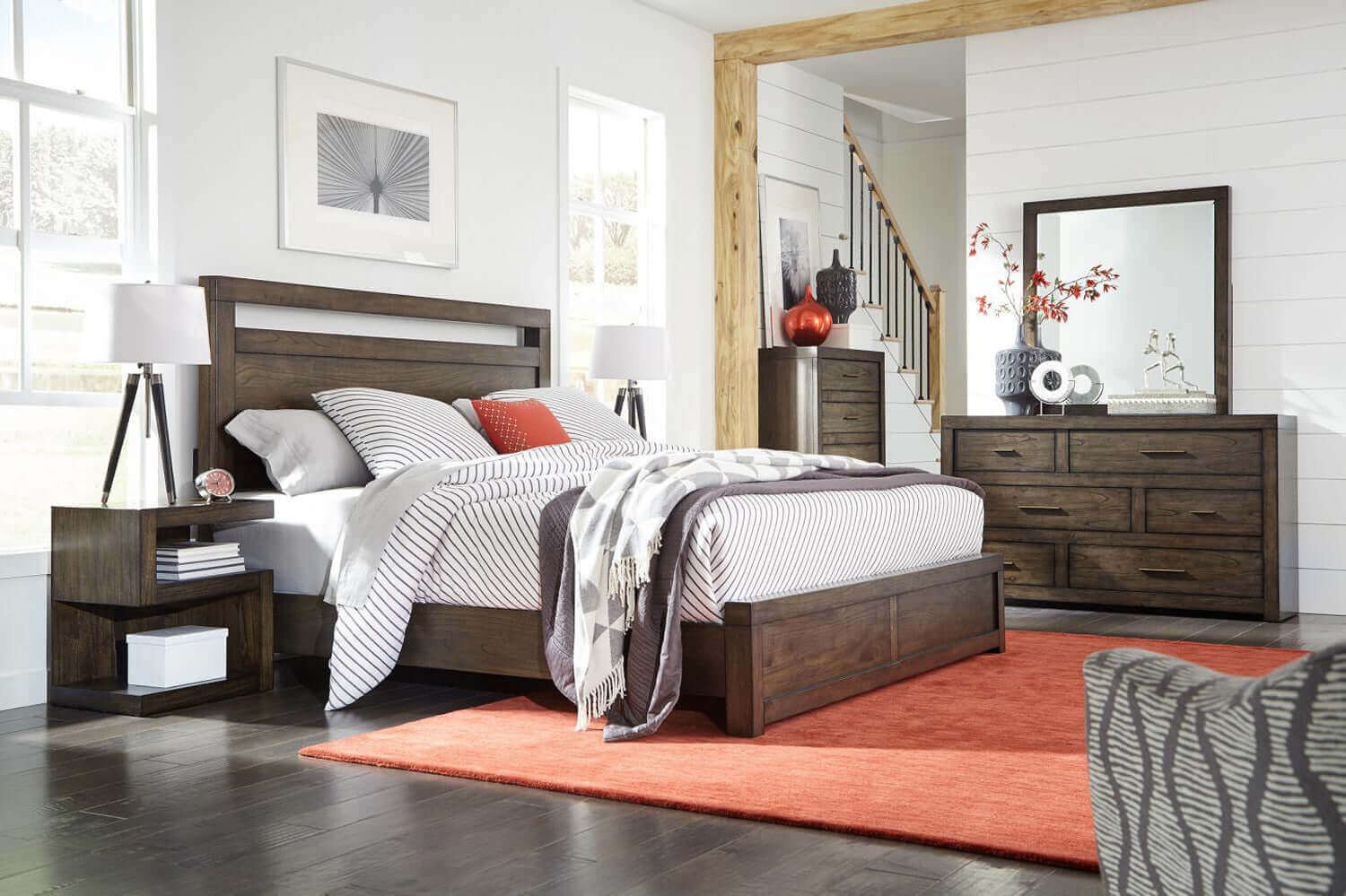 Modern Loft Collection Brownstone Panel Bed showcased in a stylish bedroom with matching nightstands and dresser.
