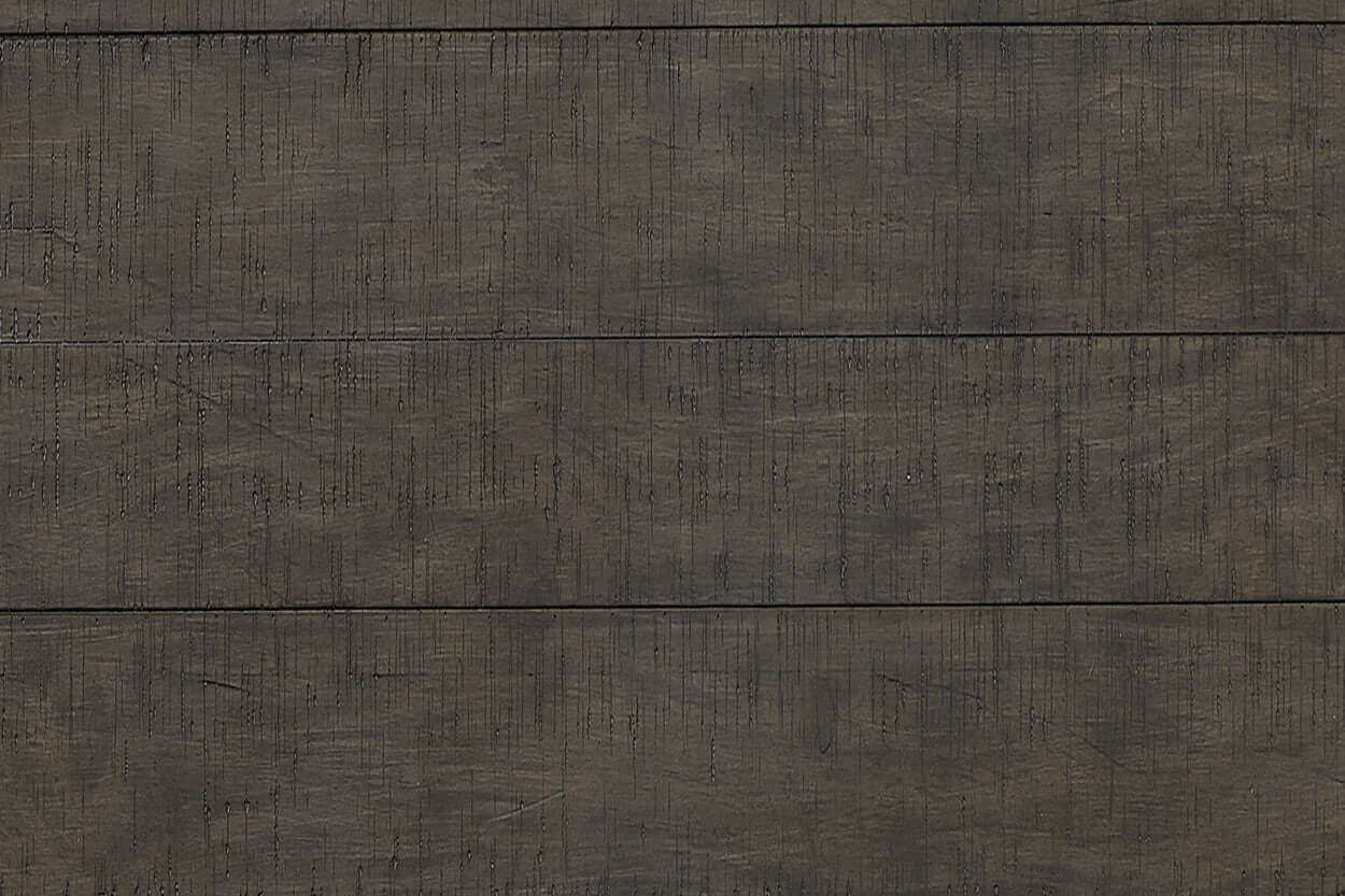 Close-up of the textured dark wood surface of the Mill Creek Collection Carob Panel Bed, showcasing its durable craftsmanship.