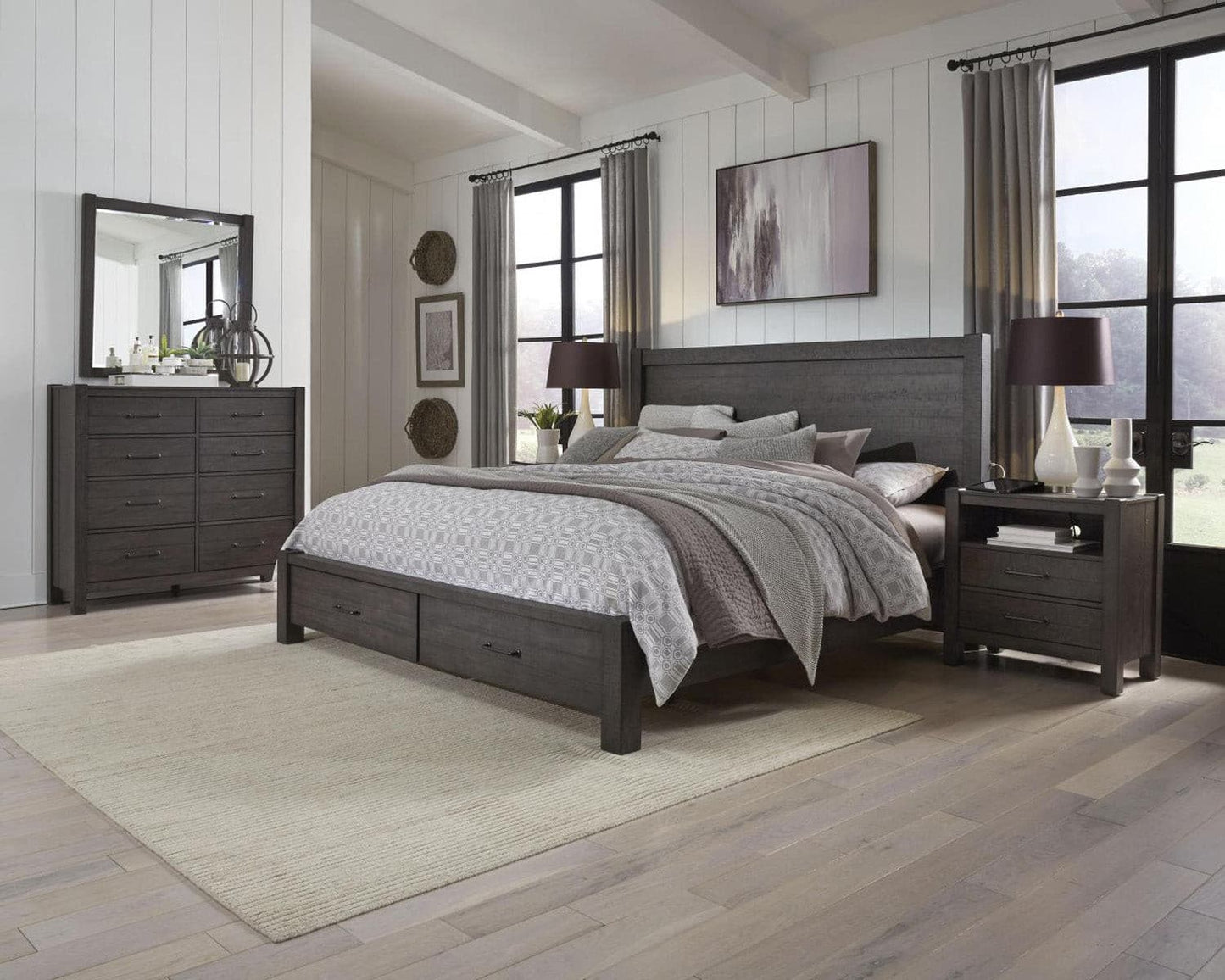 Mill Creek Collection bedroom set featuring a tall dresser, bed, nightstand, and modern decor in a bright space.