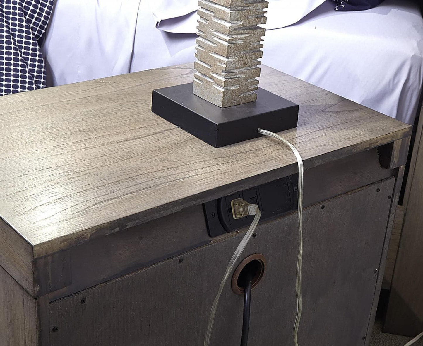 Modern Loft Graystone nightstand with unique lamp and canted AC outlets, showcasing quality craftsmanship and a stylish finish.