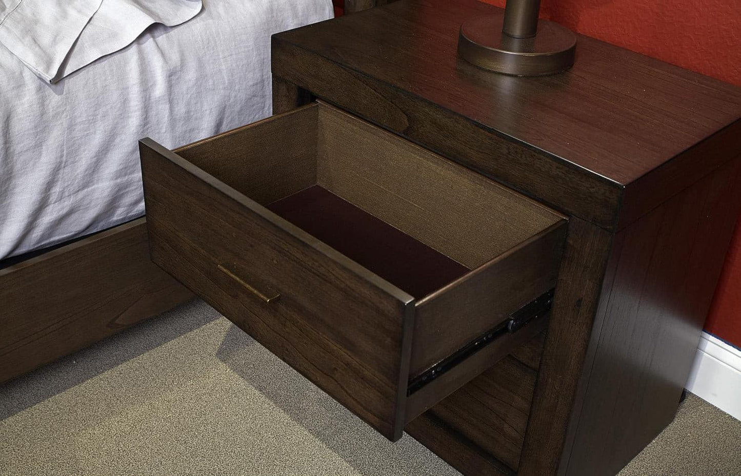 Modern Loft Brownstone nightstand with an open drawer, showcasing its classic design and aged bronze pull hardware.