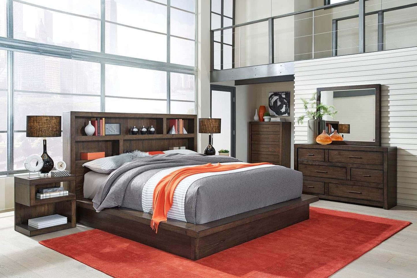 Modern Loft Collection bedroom featuring a brownstone finish bed, nightstand, dresser, and vibrant orange accents.