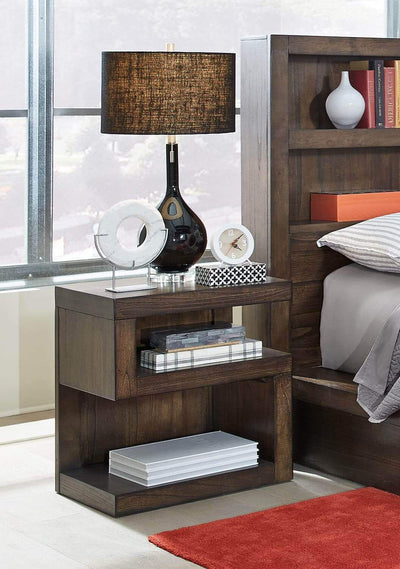 Modern Loft Collection Brownstone Nightstand with lamp and decor in stylish bedroom setting.