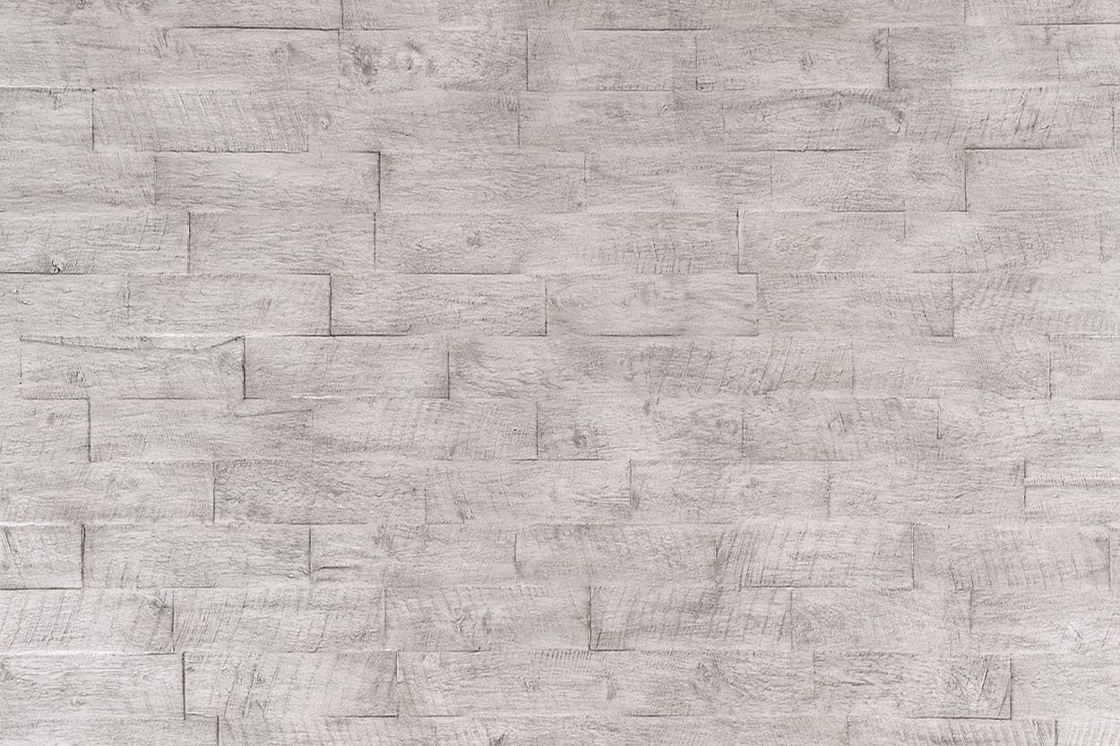 Light gray wood paneling with textured surface, creating a modern and rustic look for interior design.