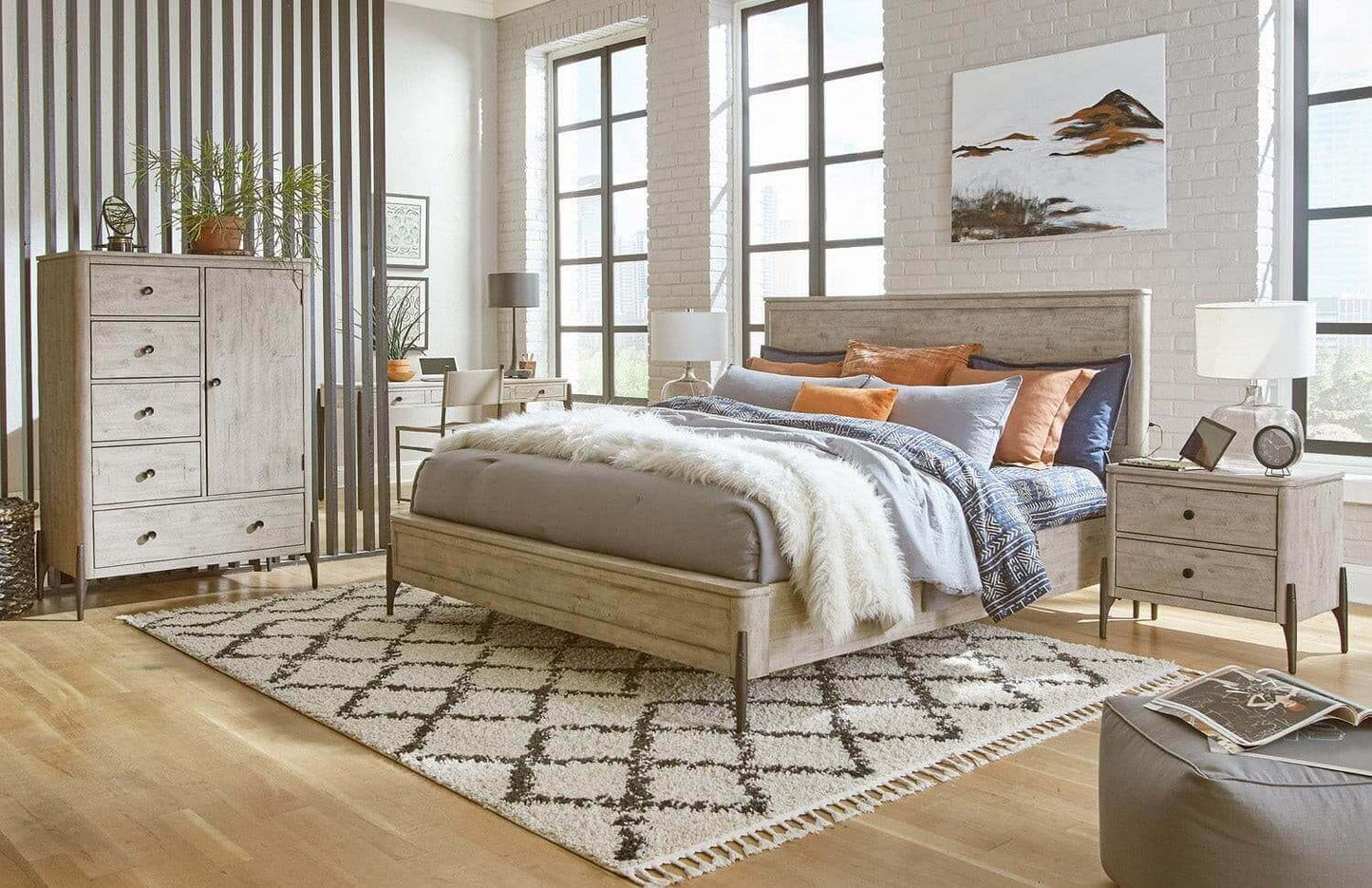 Modern bedroom featuring Zane collection chests, stylish bedding, and a cozy rug, creating a regal yet comfortable atmosphere.