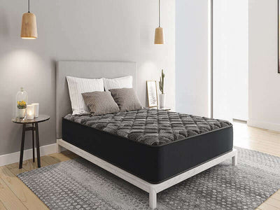 Diamond Rock Extra Firm 12" mattress on a stylish bed frame, featuring modern decor and natural light in a cozy bedroom setting.