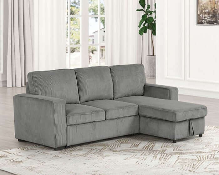 Yves Corduroy Sectional Sofa in contemporary dark gray with reversible chaise and storage, enhancing living room style and comfort.
