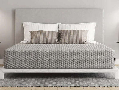Diamond Align Medium Gel Memory Foam 10" Mattress on a modern bed frame with decorative pillows and gray bedding.