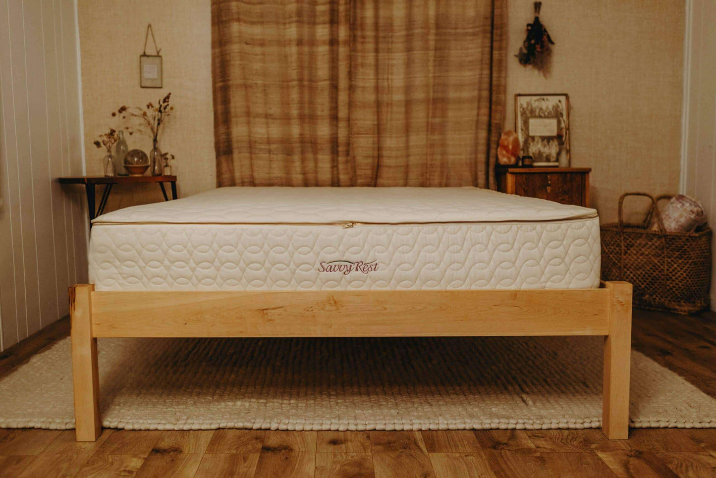 Savvy Rest Serenity Organic Latex Twin XL mattress on a wooden bed frame in a cozy room setting.