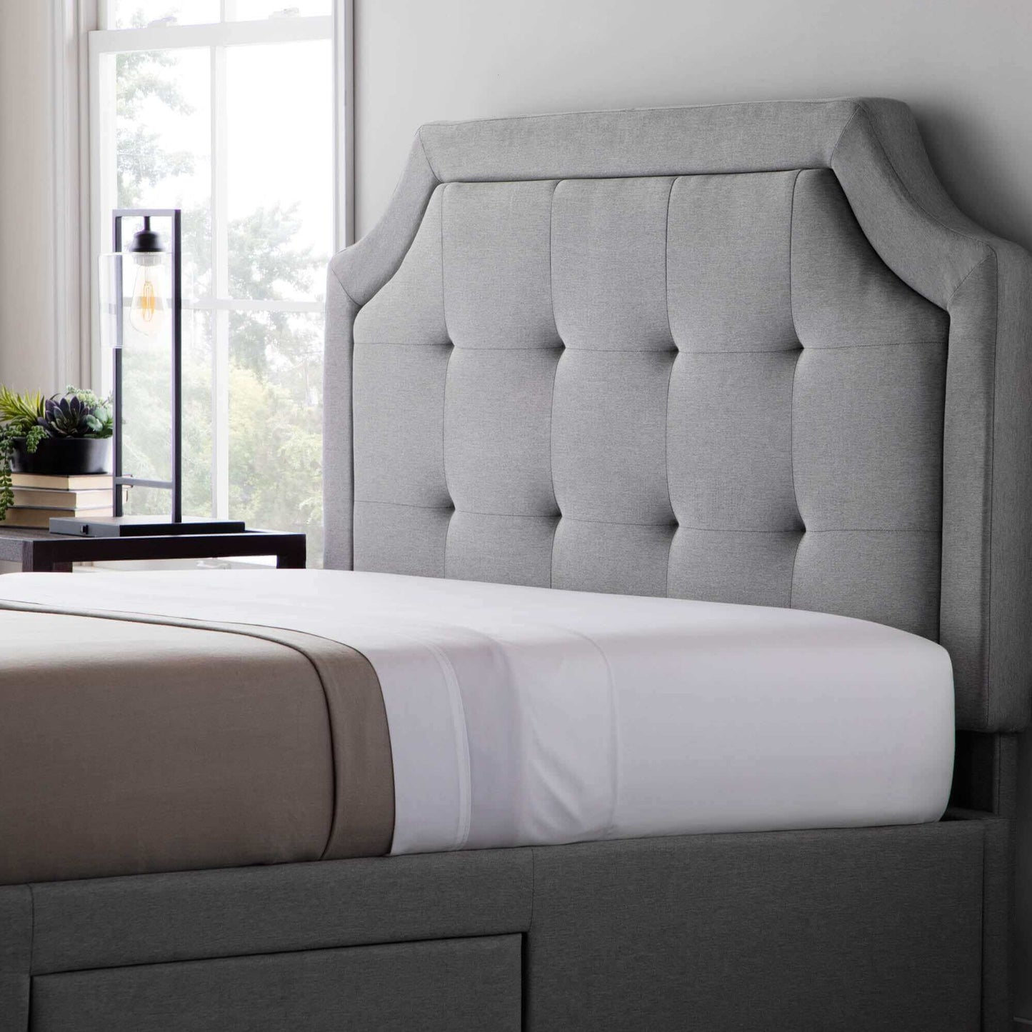 Malouf Carlisle Stone Gray Headboard with plush tufted upholstery and modern design in a cozy bedroom setting.