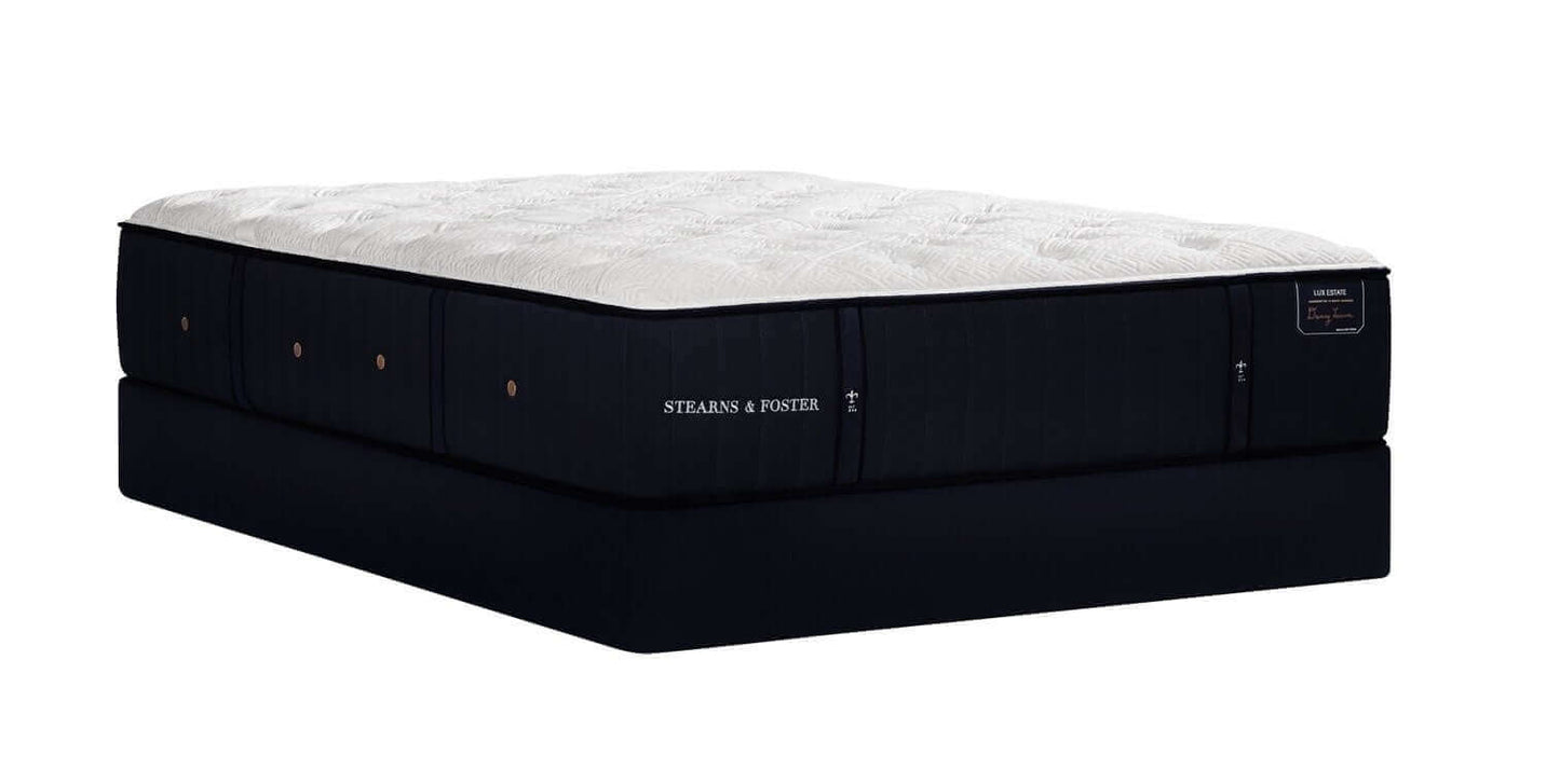 Stearns & Foster Lux Estate Cassatt Ultra Firm 14" mattress on a black foundation, showcasing its sleek design and premium materials.