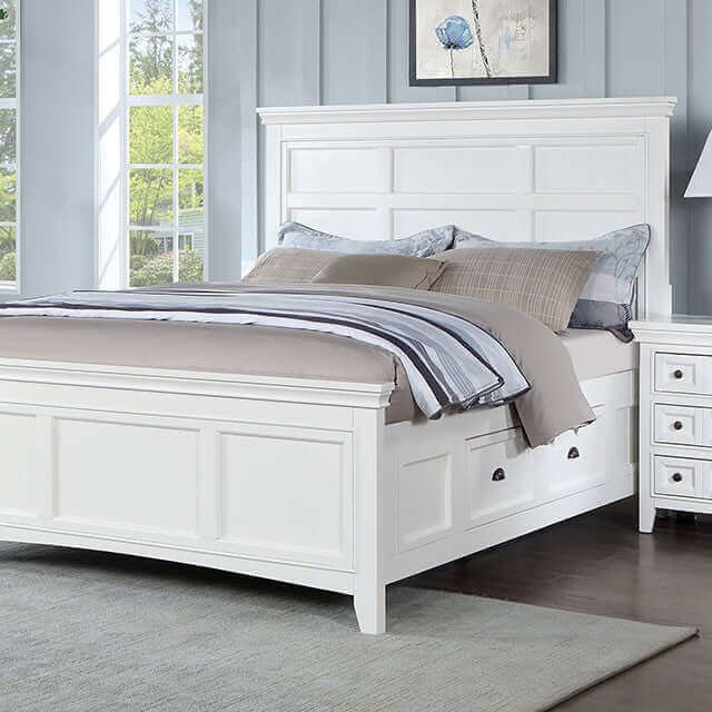 Castile White Storage Bed with crown molding, bold headboard, and large side drawers for extra storage.
