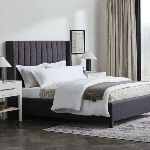 Elegant Malouf Blackwell Charcoal Headboard with plush vertical channels in a modern bedroom setting.