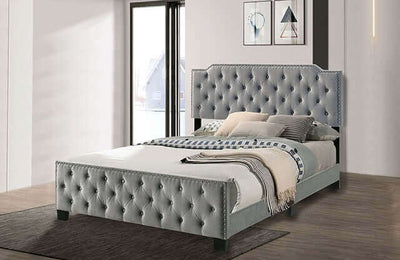 Charlize Gray Tufted Bed featuring deep button tufting and nailhead trim for a luxurious, elegant bedroom aesthetic.