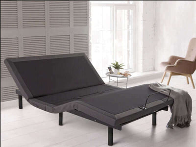 Rize® Clarity II 13" adjustable base in a modern bedroom setting with a cozy throw blanket and natural light.