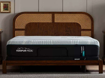 Tempur-Pedic TEMPUR-ProAdapt Medium 12" Mattress on a stylish wooden bed frame in a cozy bedroom setting.