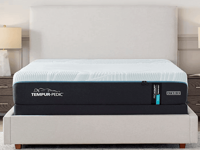 Tempur-Pedic TEMPUR-ProAdapt Medium Hybrid 12" Mattress on a stylish bed frame in a bright bedroom setting.